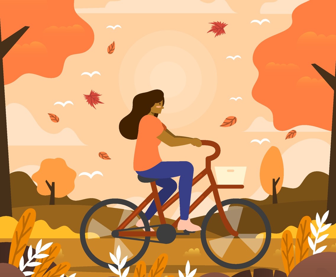 Woman Rides a Bicycle in the Autumn Evening
