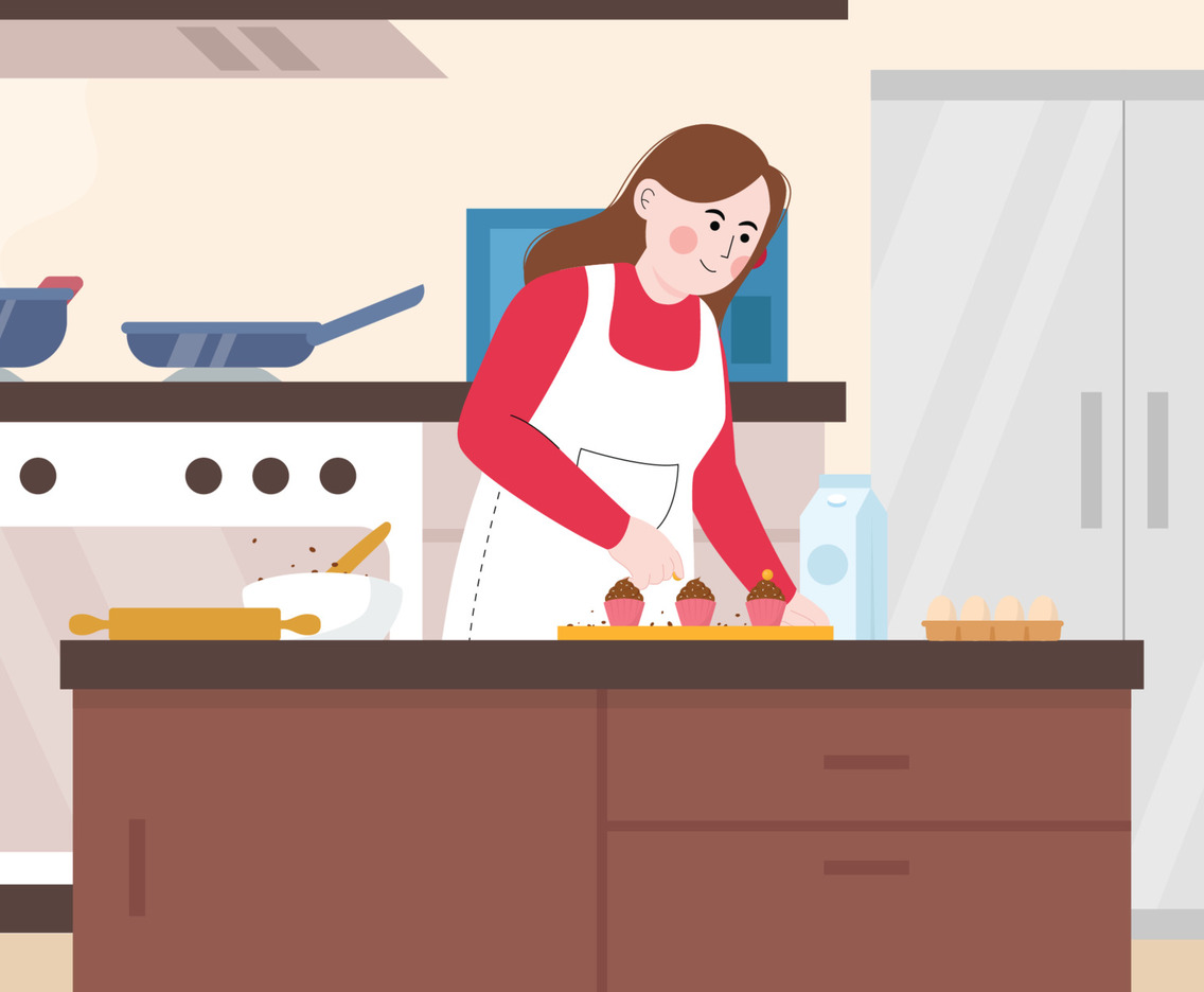 Woman Baking Cupcake in the Kitchen
