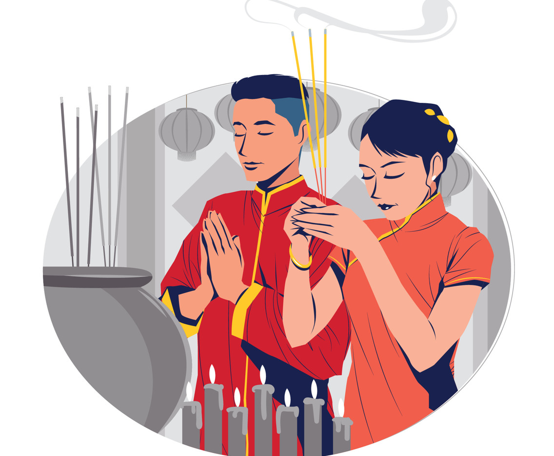 Asian Man and Woman Praying with Incense Sticks in Chinese New Year Celebration