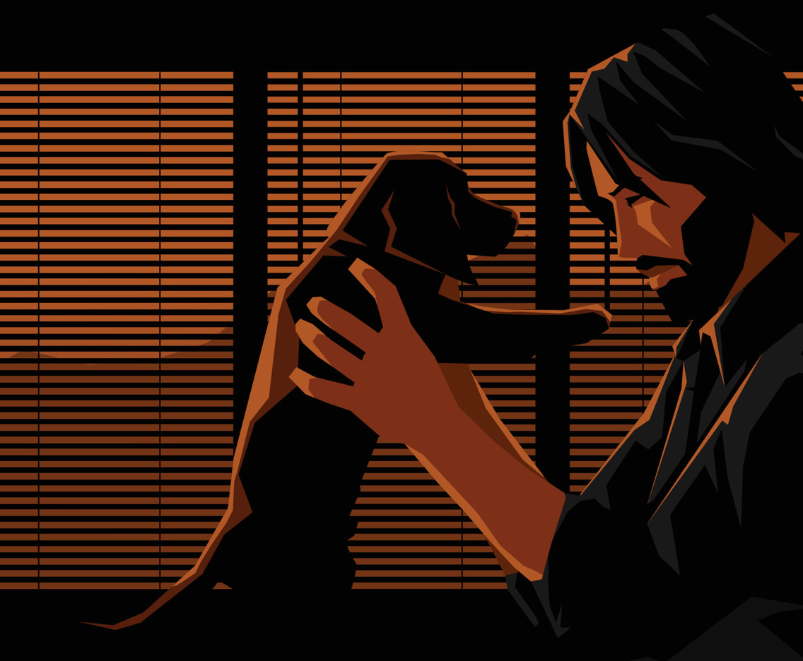 a Man Holding Up a Puppy